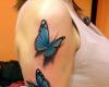 Mariposas tatuaje femenino