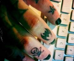 Star bat and skull tattoo