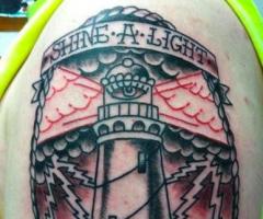 Lines lighthouse tattoo