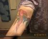 Tropical parrot tattoos