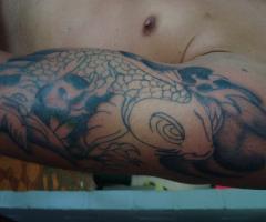 pez koy en el antebrazo