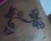 tattoo esmit tres mariposas y tribal