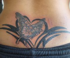 tattoo esmit mariposa y corazon tribal