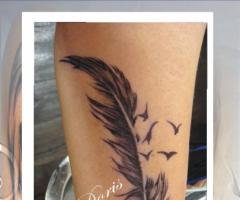 feather tattoo by Doris tattoo