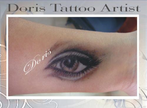 braown eye tattoo by Doris tattoo