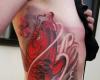 Koi tattoo pesce con i fiori