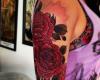 Due rose rosse tatuaggio