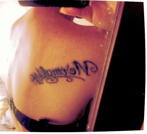 Back letters tattoo