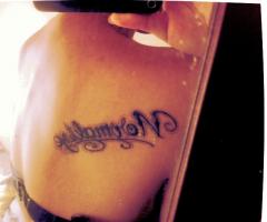 Back letters tattoo