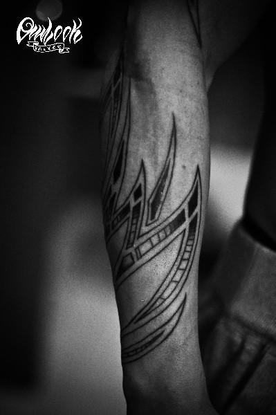 Tribal tattoo arm
