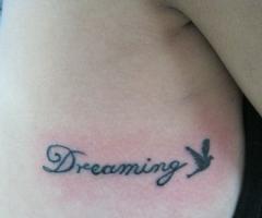 Dreaming and dove tattoo