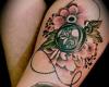 http://www.tattooset.com/images/tattoo/2013/08/13/19089-feather-flowers-and-click-on-leg-tattoo_tiny.jpg