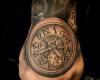 Realistic clock tattoo on hand