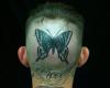 Traditional tattoo butterfly on head