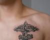 cross on chest tattoo by Tatuaje Brasov Beatris