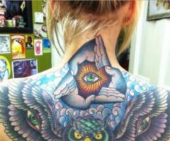 Eye and owl tattoo