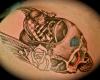 Flying skull tattoo still to put some colour in the rose