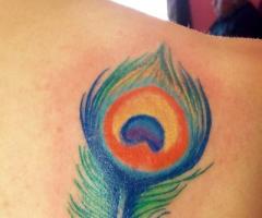 Feather tattoo by Daphne Tattoox