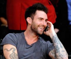 Adam Levine tiger tattoo and guitar tattoo