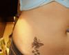 Butterfly with stars tattoo