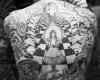 Alice in wonderland backpiece tattoo