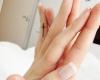 Small cross on her finger