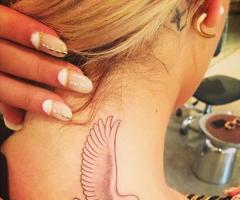Rita Ora bird tattoo on neck