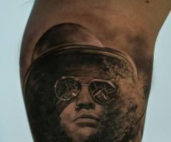Slash portrait tattoo