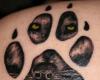 Tatouage original empreinte sur une face du Loup