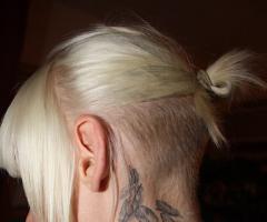 Erin Magee feather tattoo