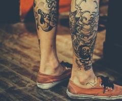 Grunge guy foot tattoo