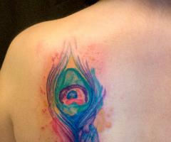 Watercolor Peacock feather tattoo