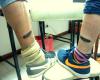 Friend feather tattoo on leg