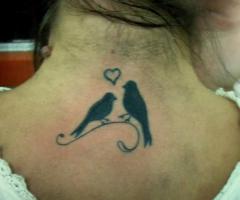Love bird tattoo on back