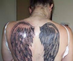 Wing tattoo on back