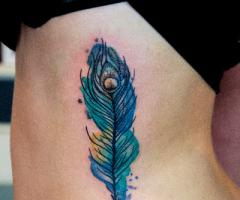 Watercolor Peacockfeather tattoo