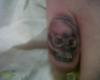skull finger tattoo