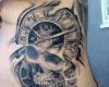 Skull and watch tattoo
