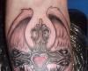 cross and rose tattoo