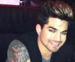 Adam Lambert showing off his tattoo sleeve