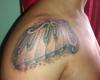 Tatuaje teclas de piano y clave de sol