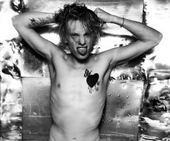 Jamie Campbell Bower heart tattoo