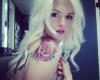 Blonde girl rose tattoo