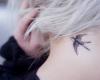  Bird tattoo on neck