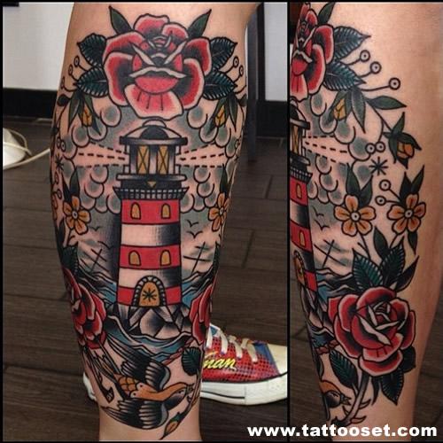 Lighthouse framed with roses tattoo