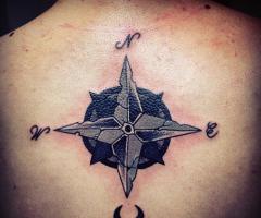 Compass tattoo on back