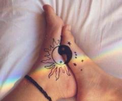 Yin and yang couple tattoo