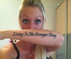 Living is the stronges drug quote tattoo