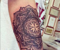 mandala arm tattoo