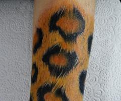 Animal print realistic tattoo